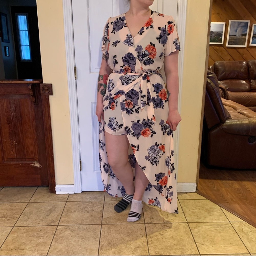 Pale pink with flowers wrap high/low dress by Candie’s.